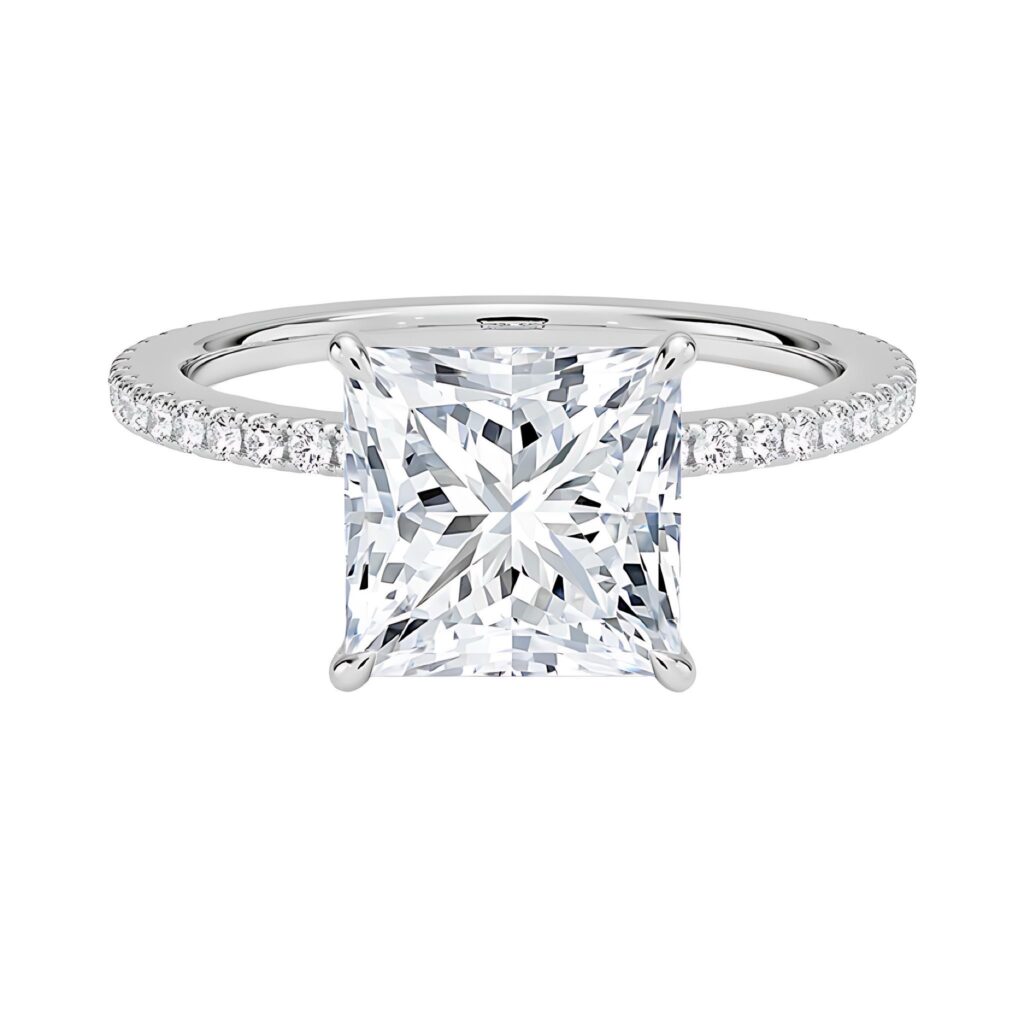 Princess-cut solitaire engagement ring on dark hand model, pavé band white gold design by JogoJewel, Ghanaian fine jeweler