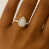 Teardrop-shaped ring in yellow gold with shimmering halo, handcrafted in Ghana by JogoJewel